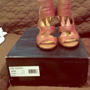 Miss Sixty genuine leather caged sandal.